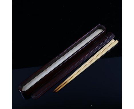 A Chinese rosewood chopstick case, length 25cm, containing a pair of ivory chopsticks 