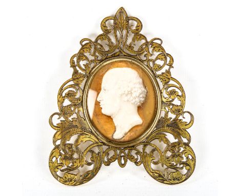 A 19th century watercolour miniature Classical portrait of a man, in original pierced and engraved brass frame, dated 1853, o