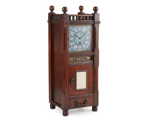 AESTHETIC MOVEMENT OAK TABLE CLOCK POST BOX LATE 19TH CENTURY the blue glazed tile dial with Arabic numerals, in an architect