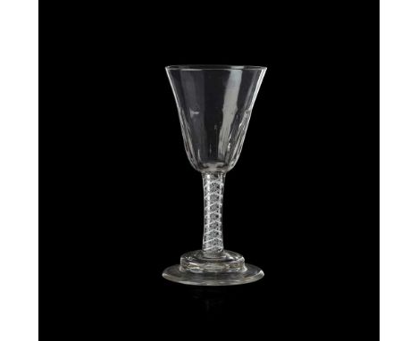 GEORGIAN LARGE OPAQUE TWIST GOBLET MID 18TH CENTURY the generous round funnel bowl partially moulded with vertical ribs, on a