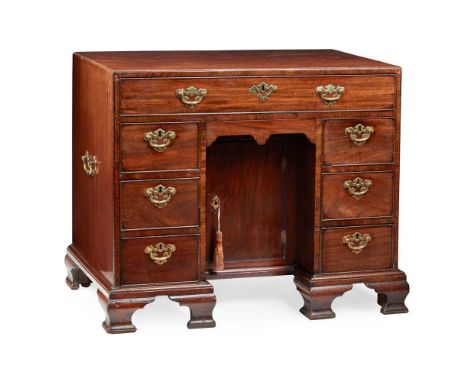 LATE GEORGE II MAHOGANY KNEEHOLE DESK  MID 18TH CENTURY the caddy top above a long drawer fitted with a ratchet-adjusted slop