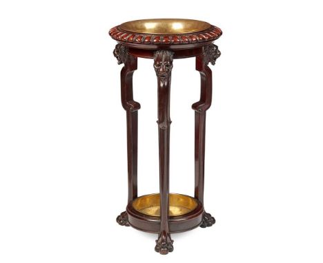 VICTORIAN MAHOGANY AND BRASS STICK STAND MID 19TH CENTURY the gadrooned ring top with a brass dish liner, on three lion’s hea