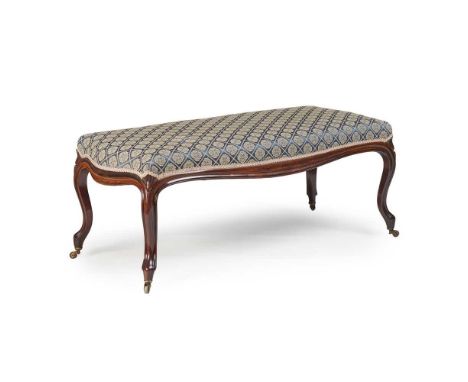 Y EARLY VICTORIAN ROSEWOOD DUET STOOL MID 19TH CENTURY the padded serpentine seat in a moulded frame raised on flower carved 