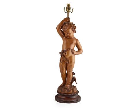 ITALIAN CARVED LIMEWOOD FIGURAL LAMP LATE 19TH/ EARLY 20TH CENTURY probably Florentine, carved as a putto with a bow sash on 