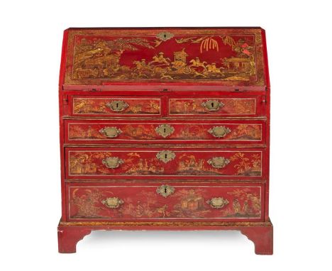 GEORGE III RED JAPANNED BUREAU  18TH CENTURY  the slope front opening to an arrangement of drawers and pigeon holes, above tw