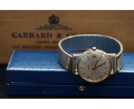 Garrard automatic Wristwatch with 9ct Gold case with original box and outer box. Currently ticking not tested for time accura