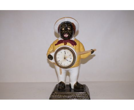 An original ceramic Banjo boy clock 40cm