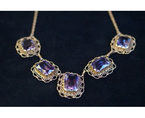 A 5 stone Amethyst necklace, each mounted individually in a filigree mount on a 14 ct gold Prine of Wales chain 55 ct Amethys