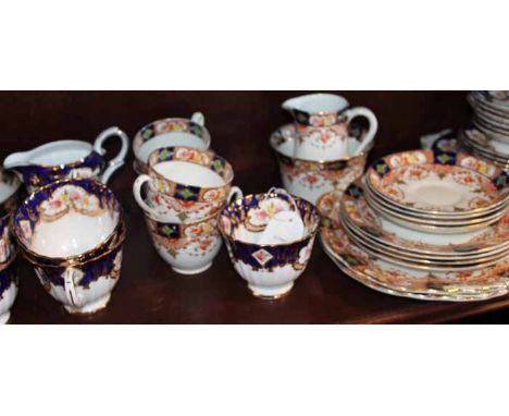 ROYAL STAFFORD BONE CHINA PART TEA SERVICE
decorated with floral swags and with gilt highlights and cobalt blue details; toge