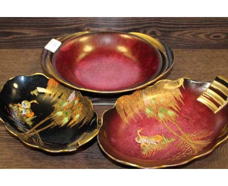 THREE CARLTON WARE DISHES
including a Rouge Royale bowl, a Rouge Royale dish with enamel and gilt cane design and a black ddi