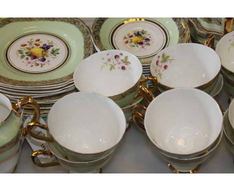 FINE ENGLISH CHINA TWELVE CUP TEA SET
in 'Vanessa' green, floral and gilt pattern, with cups, saucers, sideplates and a two c