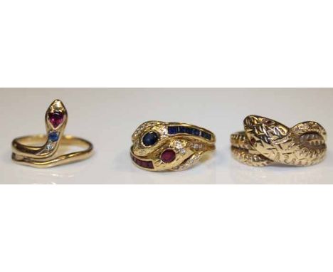 COLLECTION OF THREE GEM SET NINE CARAT GOLD SNAKE RINGS
one ring formed by two intertwined snakes, the heads set with diamond