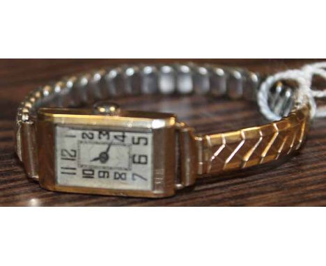 LADY'S 20TH CENTURY ART DECO NINE CARAT GOLD COCKTAIL WATCH
the silvered dial with Arabic numerals, in nine carat yellow gold