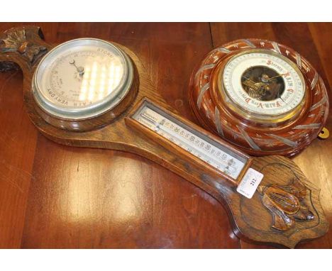 EARLY 20TH CENTURY CARVED OAK WALL-MOUNTING BAROMETER
approximately 59cm long; together with a smaller circular barometer (2)