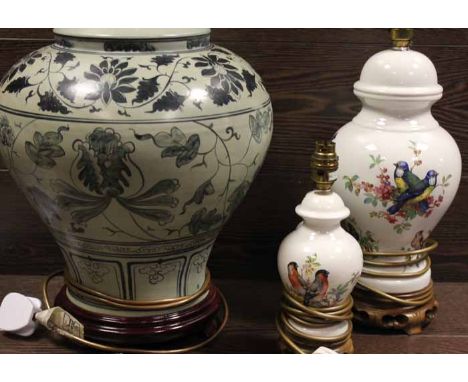 LARGE REPRODUCTION TABLE LAMP
of baluster form, in imitation of blue and white and over a wooden circular stand, 49cm high; t