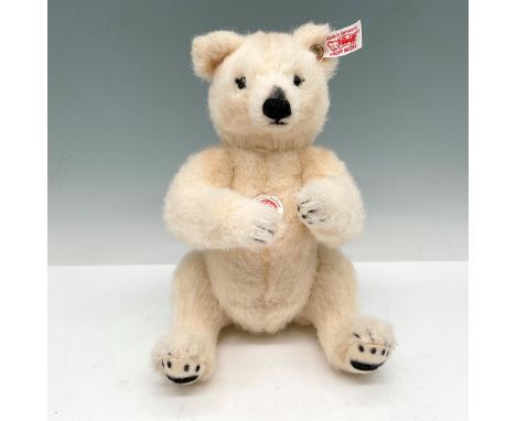 Plush white faux fur with moveable arms and legs. Accented black eyes, nose and paws. Limited edition 1500. Steiff ear tag. 0