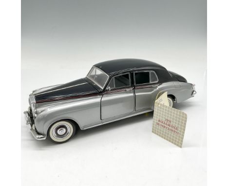 Silver and black replica of this high-end vehicle. Model has moveable doors, hood and trunk openings. Franklin Mint tag. B11U