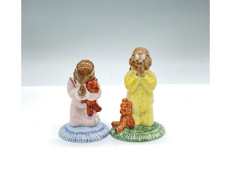 Glossy porcelain Bunnykins duo that includes: Bedtime Bunnykins modelled on a praying pose with yellow pajamas alongside a te