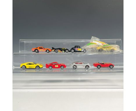 Embark on a thrilling ride with our set of 8 Hot Wheels toy cars, featuring iconic models like the sleek 32 Ford in black, th