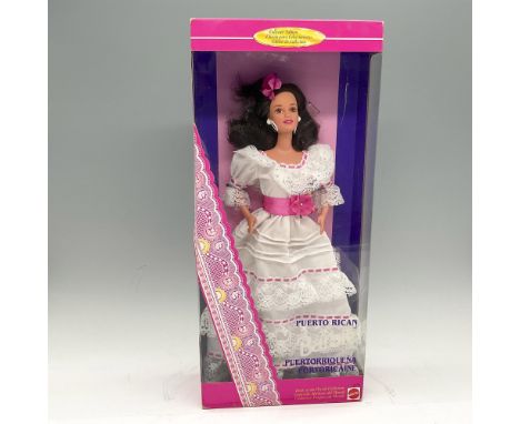 New in box. Dressed in white cotton dress with lace with pink flower belt, large earrings and flower in her hair. This item h