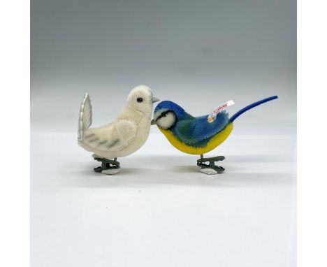 Both are attached to a metal clip. Off-white dove ornament, 3"L x 3"W x 3.75"H; includes original box, 5.5"L x 3.25"W x 8"H a