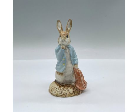 Peter &amp; the Red Pocket Handkerchief. Glossy porcelain Peter Rabbit modeled on a blue jacket with yellow buttons holding a