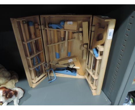 A selection of childs wood working tools contained in carry case