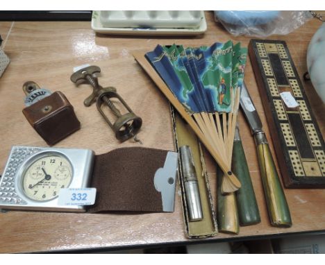 A selection of miscellaneous including treen score board, light meter, travel clock, corkscrew etc
