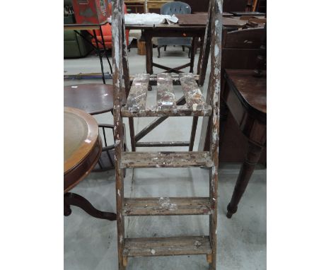 A set of vintage wooden step ladders