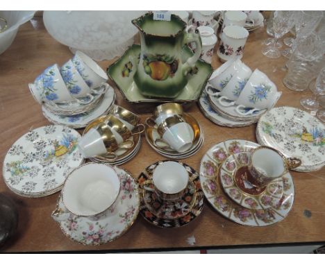A selection of tea cups and saucers including Crown Derby
