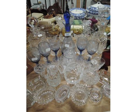 A large selection of decanters and other decorative glass ware included silver mounted scent bottle