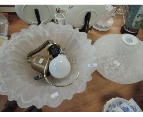 Two mottled and white smoked light shades