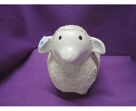 A ceramic figure of a sheep