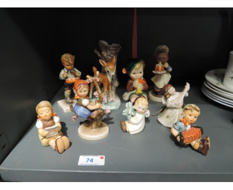 Nine Hummel and similar figures and ornaments including Pumpkin Pie Boy, Apple Tree Girl, Angels etc