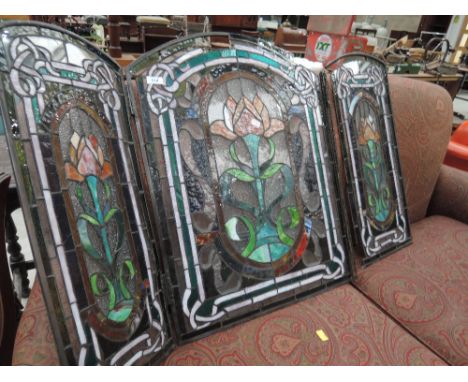 A stained glass fire screen