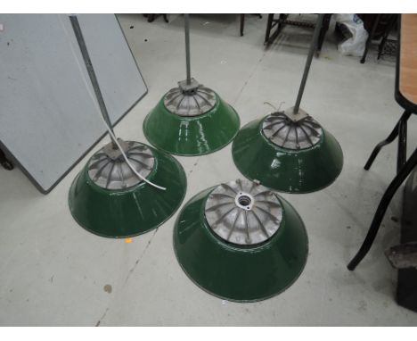 A selection of industrial enamel light fittings