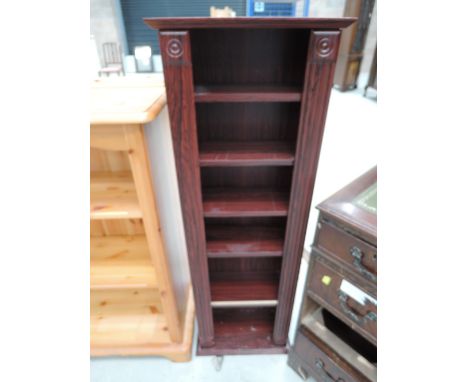 A laminate Rosewood effect book/CD shelf unit