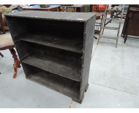 A rustic book or tool shelf