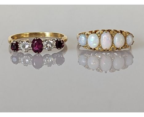 A five-stone ruby and diamond ring on an 18ct yellow gold setting, the central ruby 5 x 3mm, the other stones each approximat