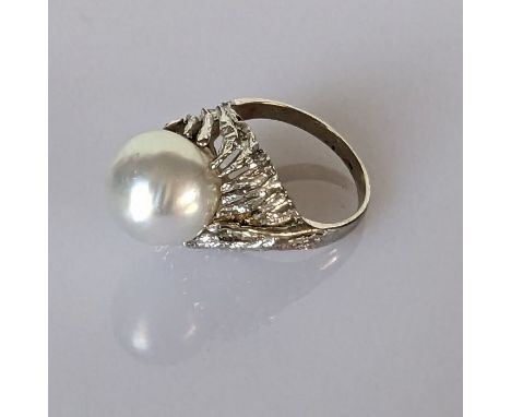 A vintage white gold and pearl dress ring, stamped 14k, size N, 7g