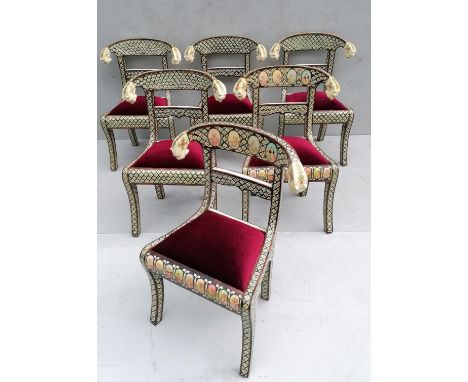 A set of six Indian bone inlay chairs with polychrome carved tiger head and floral decoration to supports, fabric upholstered