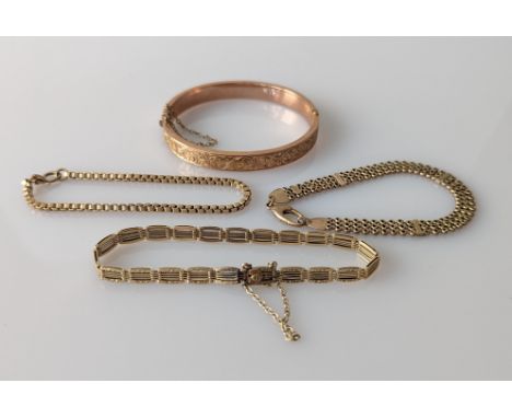 A 14ct yellow gold fancy-link bracelet, 6.5g, stamped; two others on 9ct gold, all 17 cm and a 9ct rose gold bangle with etch