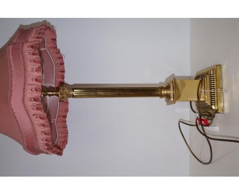A large brass lamp and shade
