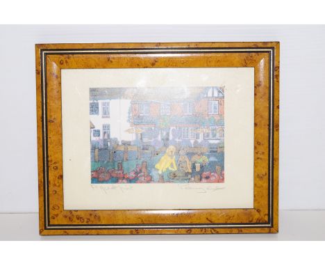 A small framed print signed and titled 