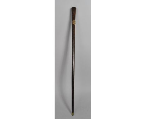 A Turned Wooden Swagger Stick with Military Rampant Lion and Kings Crown Metal Mount inscribed "Honi Soit Qui Mal Y Pense" 