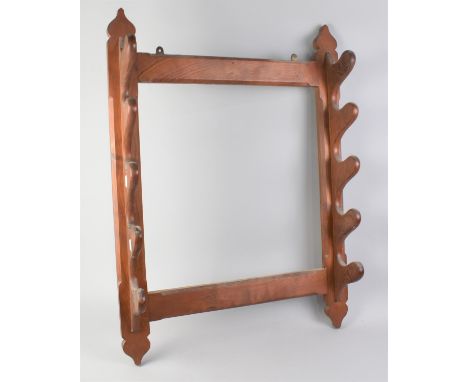 An Early 20th Century Four Section Wall Hanging Gun or Fishing Rod Rack with Inscribed Paper Label, "This Rack is Made Out of