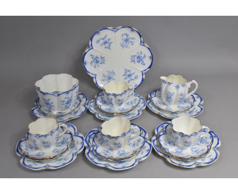 An Edwardian Blue and White Transfer Printed Tea Set of Moulded Flower Head Design to comprise Four Cups, Slop Bowl, Milk Jug