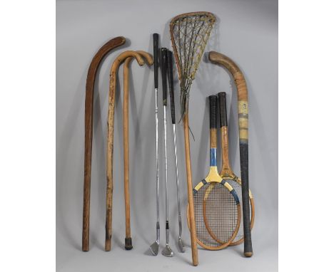 A Collection of Various Rackets, Lacrosse Stick, Golfing Irons Etc 
