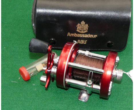 REEL: ABU Ambassadeur 6000 red multiplier reel in as new condition, 3 screw smooth end plate foot stamp750908, black handle, 
