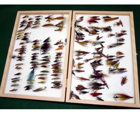 FLIES: Good collection of modern mainly hair wing salmon flies on black hooks, singles, doubles and trebles, in a double side